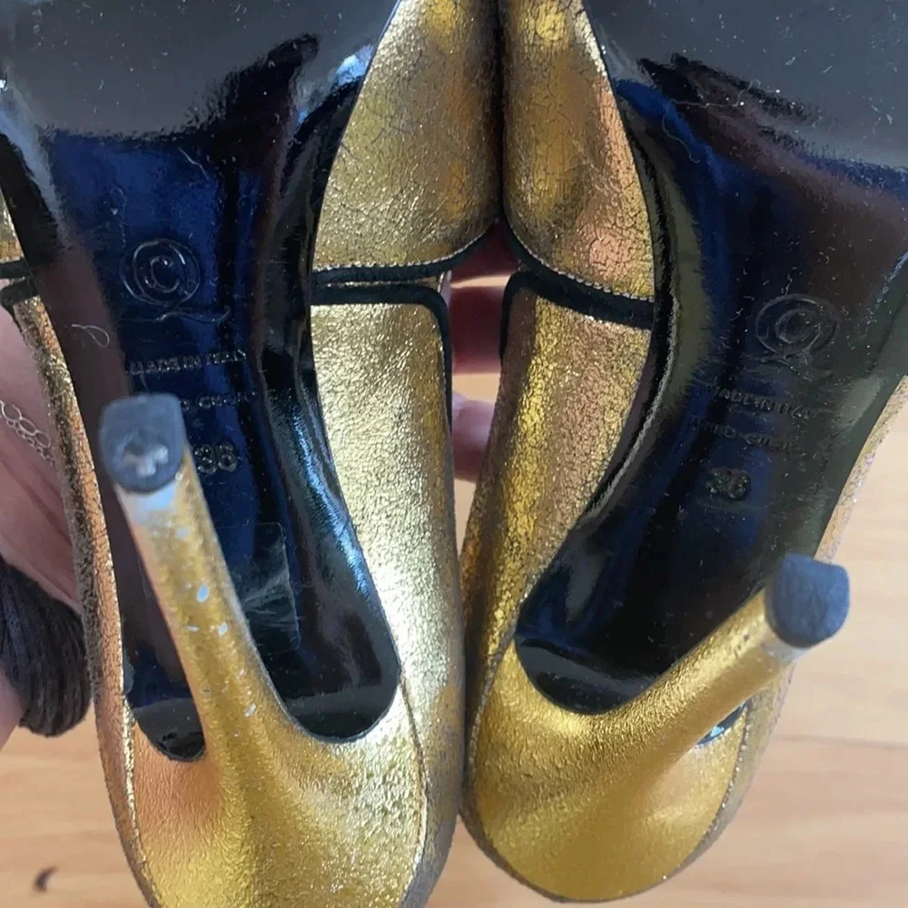 Alexander McQueen gold and black peep toe stilettos